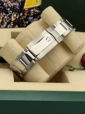 Rolex Oyster Perpetual date 34mm 115210 blue baton dial, engine turned bezel, oyster, 2008