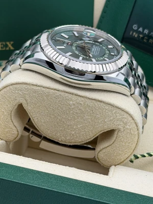 Rolex Sky-Dweller 42mm, 336934, mint green dial, white gold fluted bezel, stainless steel jubilee bracelet.2026 unworn