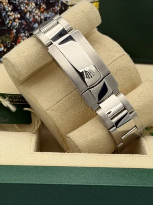 Rolex Oyster Perpetual date 34mm 115210 blue baton dial, engine turned bezel, oyster, 2008