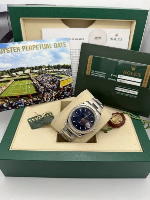 Rolex Oyster Perpetual date 34mm 115210 blue baton dial, engine turned bezel, oyster, 2008